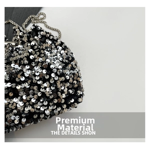 Close-up detail of silver sequin bucket bag with elegant metallic chain strap