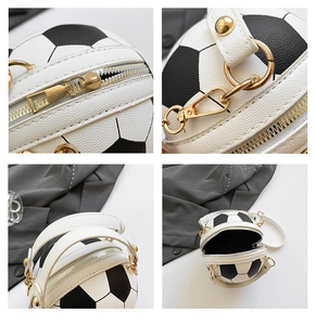 Detail of soccer ball crossbody bag featuring gold hardware and black-and-white lychee texture