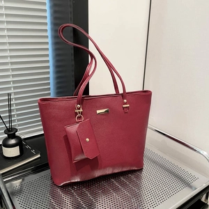 Minimalist dark red tote bag set with matching inner pouch and gold hardware accents