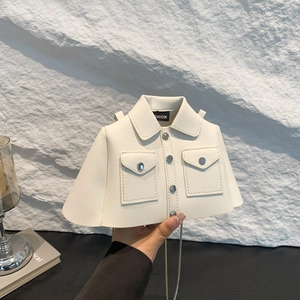 Creative white shirt shaped PU leather crossbody bag with metal chain on rock background