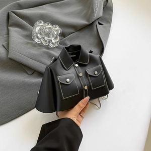 Mini black jacket shaped crossbody bag with contrast stitching and silver chain strap
