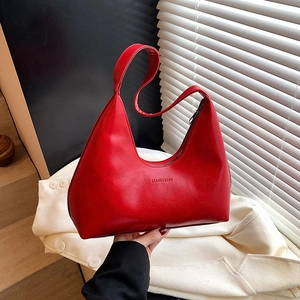 Minimalist red glossy leather hobo crescent bag with shoulder strap for spring 2025