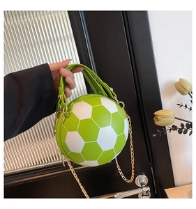 Detail of creative football-shaped crossbody bag with green and white lychee leather texture
