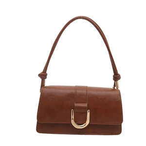 Borsa baguette vintage in pelle marrone con grande fibbia a D dorata da donna