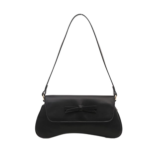 Minimalist black baguette shoulder bag with a 3D bow accent and gold hardware detail