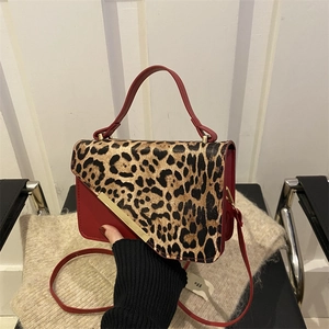 Red leather underarm bag with leopard print flap and gold trim for women's fashion