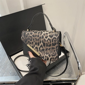 Retro leopard print underarm bag with gold metal trim and black top handle for women