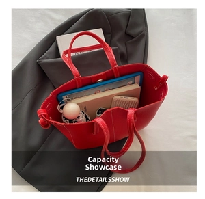Spacious red lychee pattern PU leather tote bag showing internal storage for tablet and umbrella