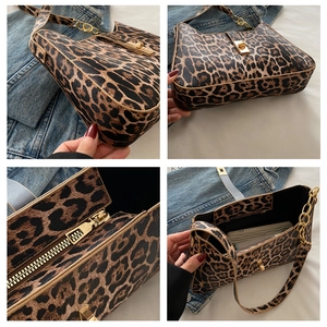 Detail view of leopard print shoulder bag with gold hardware and spacious interior