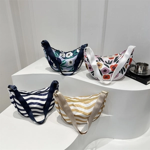 Fashionable crossbody crescent bags in floral and striped prints with wide straps