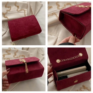 Detailed views of burgundy matte shoulder bag with gold S buckle and chain strap