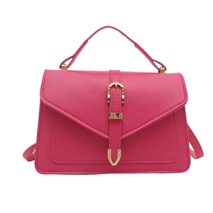 Minimalist magenta PU leather crossbody bag with decorative golden buckle and top handle