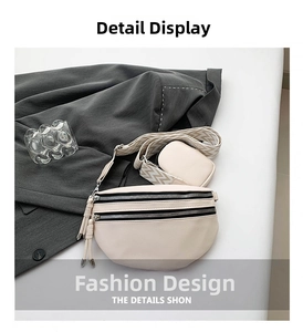 Detail of beige crossbody bag with double zippers and wide patterned woven shoulder strap