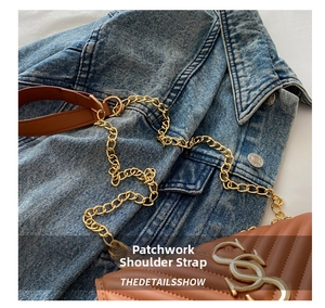 Detailed view of quilted faux leather texture with large gold double S logo and chain strap