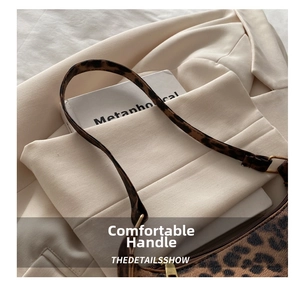 Top view of leopard print shoulder bag showing spacious interior and secure zipper
