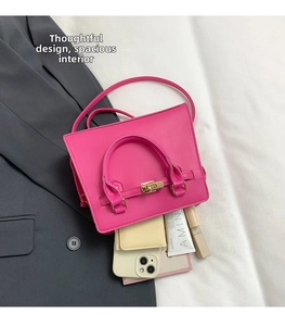 Pink crossbody handbag interior showing storage for phone, wallet, and lipstick