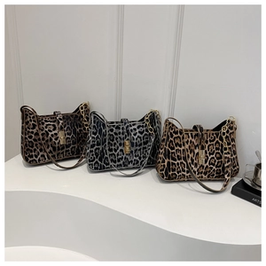 Three stylish leopard print shoulder bags in brown and gray with gold metal chain straps