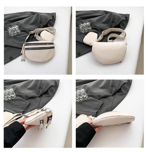Detail view of beige crossbody chest bag with double zippers and wide geometric strap
