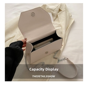 Interior view of off-white leather bag showing storage space for mobile phone