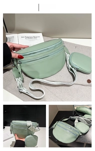 Detail of light green pebbled leather crossbody bag with woven strap and small coin pouch