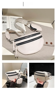 Detail of white crescent crossbody bag with zigzag wide strap and detachable coin purse