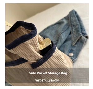 Detail view of corduroy tote side pocket with deep blue trim showing lipstick storage