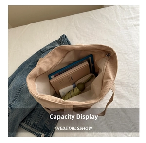 Interior view of large capacity corduroy tote bag showing daily storage items
