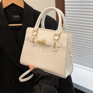 Minimalist white leather Kelly style handbag with gold hardware for office commuting