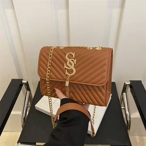 Brown V-quilted faux leather crossbody bag with gold chain strap and metal S logo