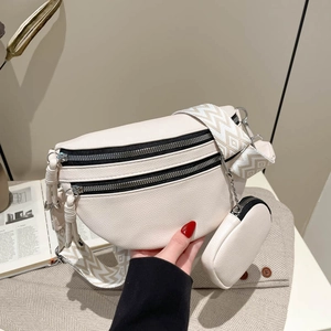 Minimalist beige crossbody chest bag with wide geometric strap and small coin pouch