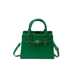 Green leather tote bag with gold turn-lock and adjustable shoulder strap for women