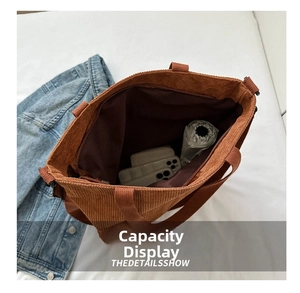 Spacious corduroy tote bag interior with zipper showing large capacity for daily items