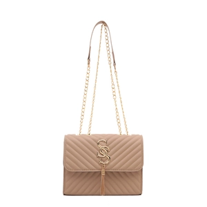 Elegant beige quilted crossbody bag with golden V-stitch, tassel, and chain strap