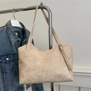 Chic beige oversized tote bag with vintage wrinkled faux leather and gold lettering