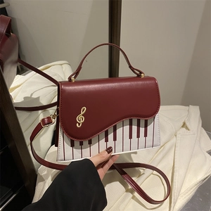 Fashionable piano theme crossbody bag with treble clef hardware and piano key pattern