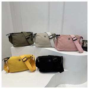 Five assorted nylon crossbody bags featuring minimalist design and adjustable wide shoulder straps