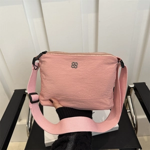 Pink casual nylon crossbody bag with silver flower logo and adjustable wide strap