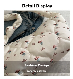 Detail of white quilted floral shoulder bag with satin finish and Beautiful embroidery