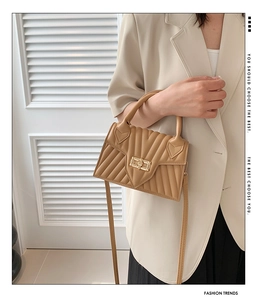 Fashionable khaki leather crossbody bag with V-quilt pattern and gold twist lock clasp