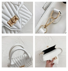 Details einer weißen Stepptasche mit goldenem Drehverschluss und Metallschnallen am Gurt