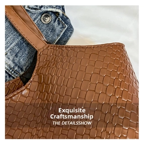 Close-up of the woven texture and premium brown faux leather on this fashion tote bag