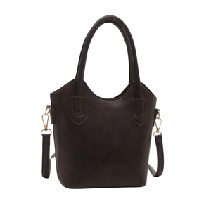 Deep brown stylish bucket bag with gold hardware shown in a front studio view