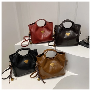 Retro faux leather tote bags in four colors with triangle logo and tassel detail