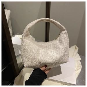 Close-up of cream woven hobo bag showing the intricate intrecciato leather texture and detail