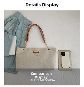 Detailed view of beige woven tote bag with leather chain strap and deer charm accessory