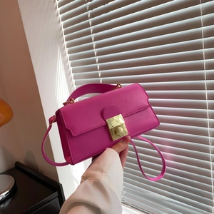 Rose red minimalist shoulder bag with golden lock buckle and adjustable strap