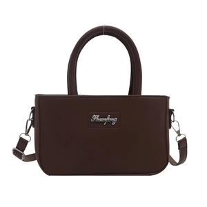 Minimalist dark brown square handbag with silver logo and dual handles in matte PU leather
