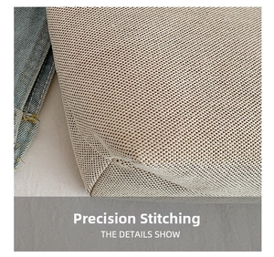 Close-up of precision stitching and textured canvas material on a commuter tote bag