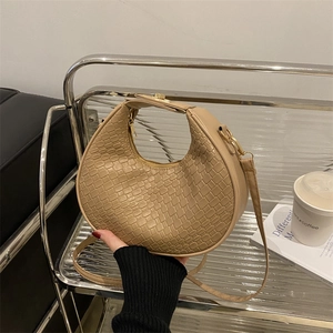 Chic beige half-moon hobo bag with woven texture and elegant top handle for women