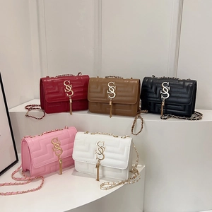 Minimalist vintage crossbody bag set with geometric stitching and gold S-buckle tassel